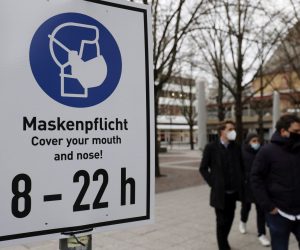 epa08937088 A sign demands wearing face masks at the shopping street 'Zeil' in Frankfurt am Main, Germany, 14 January 2021. Due to an increasing number of cases of the COVID-19 pandemic caused by the SARS CoV-2 coronavirus, nationwide restrictions have been introduced to counteract a rise in infections.  EPA/RONALD WITTEK