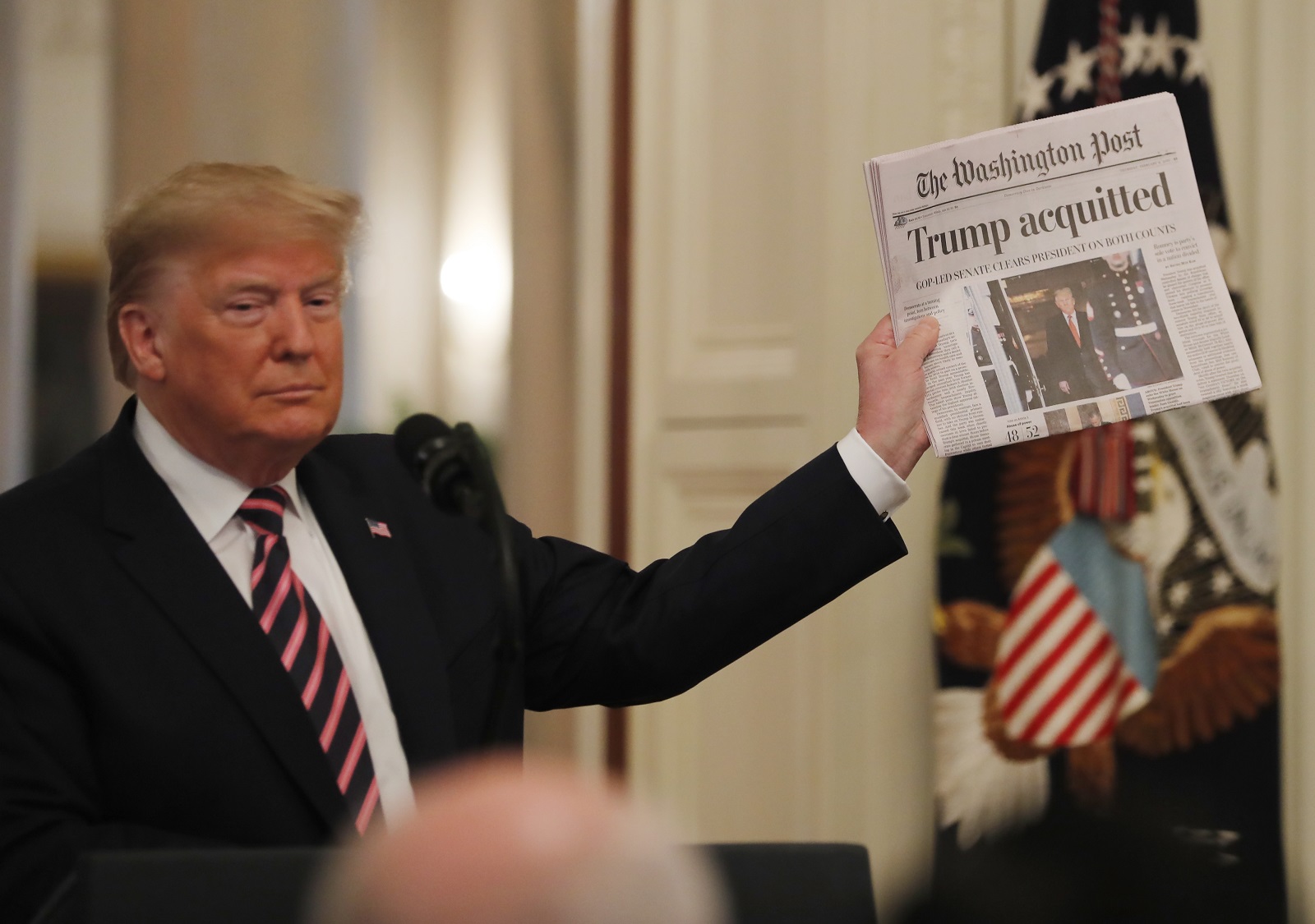 epa08939630 (FILE) US President Donald J. Trump holds the front page of the Washington Post with headline 'Trump acquitted' as he speaks in the East Room of the White House a day after his Senate impeachment trial acquittal in Washington, DC, USA, 06 February 2020. Trump was found not guilty on two articles of impeachment 05 February 2020 after a two-week trial. The presidency of Donald Trump, which records two presidential impeachments, will end at noon on 20 January 2021.  EPA/ERIK S. LESSER *** Local Caption *** 55854439