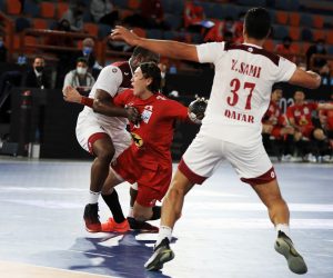 epa08943882 A handout photo made available by Egypt Handball 2021 of Hassan Mabrouk (L) of Qatar in action against Hiroki Motoki (C) of Japan during the match between Qatar and Japan at the 27th Men's Handball World Championship in Alexandria, Egypt, 17 January 2021.  EPA/Hazem Gouda / Egypt Handball 2021 HANDOUT SHUTTERSTOCK OUT HANDOUT EDITORIAL USE ONLY/NO SALES