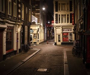 epa08947747 An empty street at night amid the ongoing coronavirus pandemic in Amsterdam, Netherlands, 18 January 2021 (issued 19 January 2021).  EPA/Ramon van Flymen