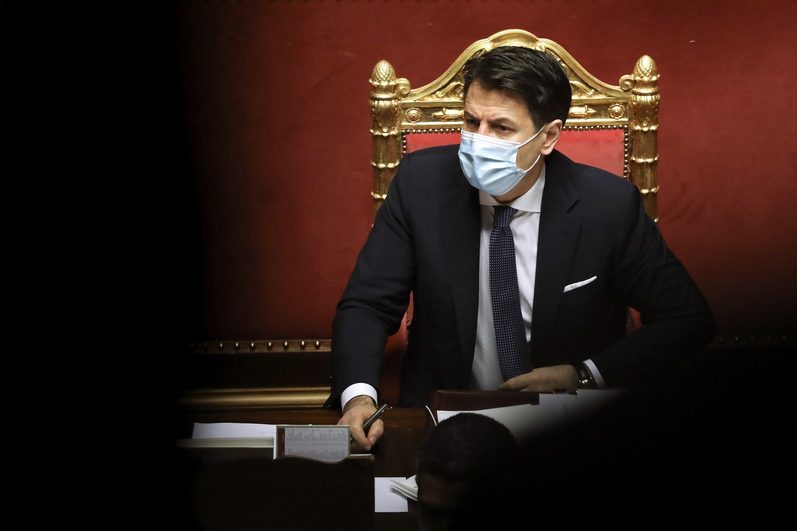epa08949115 Giuseppe Conte, Italy's prime minister, listens during a debate in the Senate in Rome, Italy, 19 January 2021. Following the resignation of two ministers in Italian Prime Minister Conte's coalition government over a dispute on spending of EU funds during the pandemic, the Italian government is on the verge of another crisis.  EPA/Alessia Pierdomenico / POOL