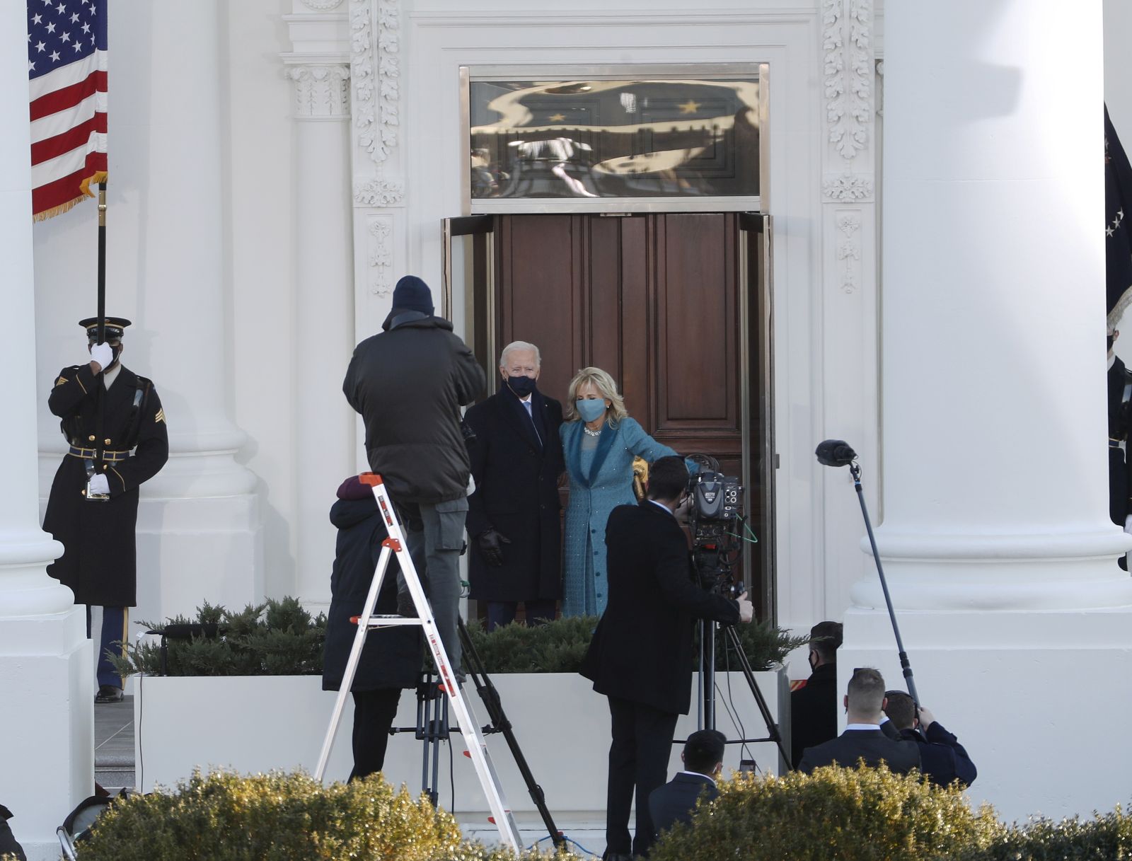 epa08954154 US President Joe Biden and First Lady Dr. Jill Biden pose as they prepare to enter the White House following the inauguration ceremony on the West Front of the US Capitol in Washington, DC, USA, 20 January 2021. Biden won the 03 November 2020 election to become the 46th President of the United States of America.  EPA/SHAWN THEW