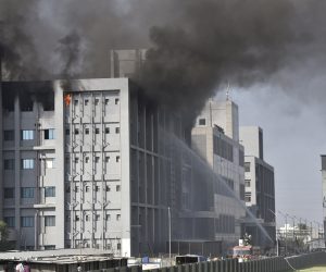 epa08955236 Firefighters try to extinguish a fire at a building of the Covid vaccine-maker Serum Institute of India's Pune facility in Pune Maharashtra, India, 21 January 2021. A massive fire broke out in one of an under construction building of the facility which is spread over 100 acres and no damage and causality reported as many fire engines reached the spot.  EPA/STR