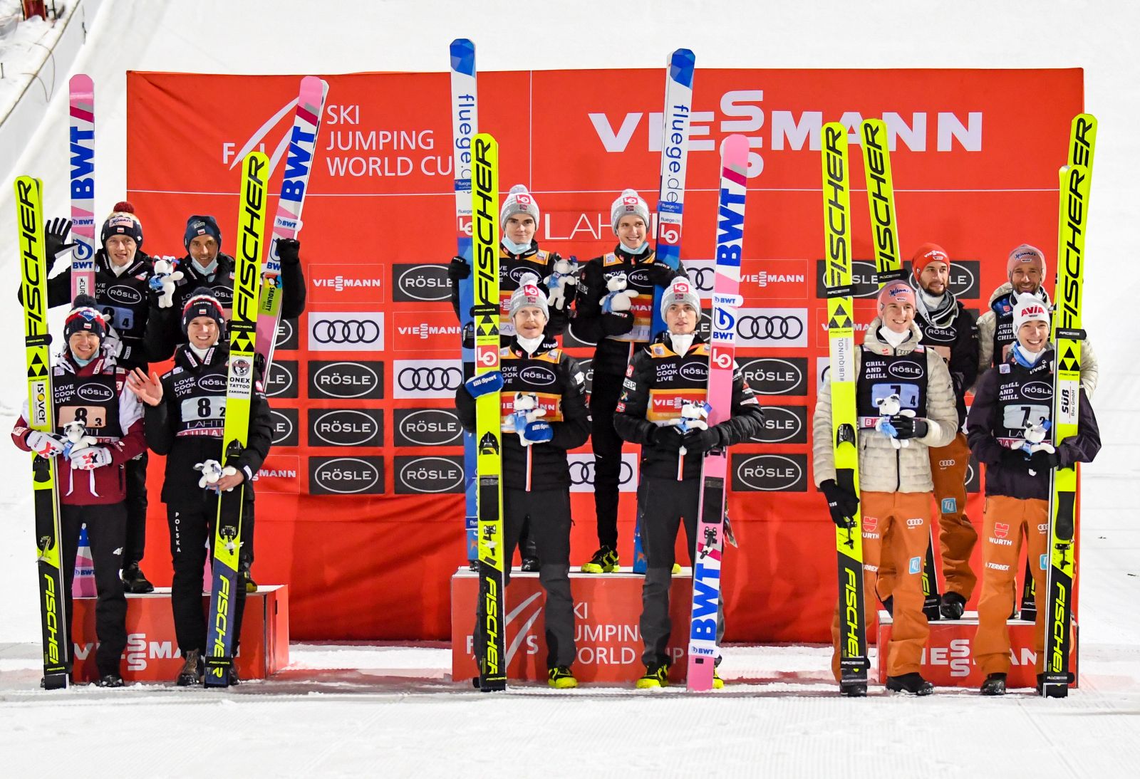 epa08960653 Second placed Team of Poland (L), winner team of Norway (C) and third placed team of Germany (R) celebrate on the podium for  the Men's Large Hill Team competition at the FIS Ski Jumping World Cup in Lahti, Finland, 23 January 2021.  EPA/KIMMO BRANDT