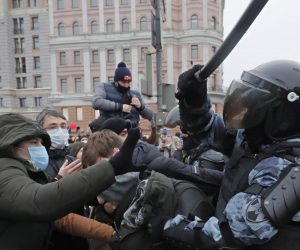 epa08960712 Russian special police units officers clash with protesters during an unauthorized protest in support of Russian opposition leader and blogger Alexei Navalny, in Moscow, Russia, 23 January 2021. Navalny was detained after his arrival to Moscow from Germany on 17 January 2021. A Moscow judge on 18 January ruled that he will remain in custody for 30 days following his airport arrest. Navalny urged Russians to take to the streets to protest. In many Russian cities mass events are prohibited due to an increasing number of cases of the COVID-19 pandemic caused by the SARS CoV-2 coronavirus.  EPA/MAXIM SHIPENKOV