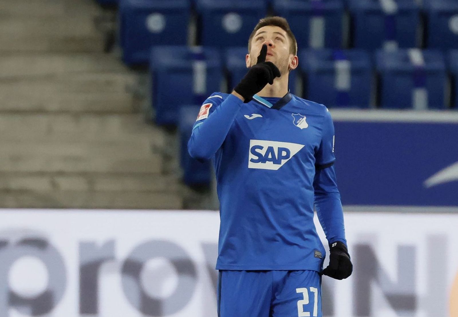 epa08962683 Hoffenheim's Andrej Kramaric celebrates scoring the first goal during the German Bundesliga soccer match between TSG 1899 Hoffenheim and 1. FC Cologne in Sinsheim, Germany, 24 January 2021.  EPA/RONALD WITTEK CONDITIONS - ATTENTION: The DFL regulations prohibit any use of photographs as image sequences and/or quasi-video.