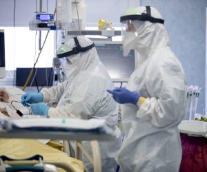 epa08968678 Health workers wearing personal protective equipment (PPE) work inside the intensive care unit (ICU) of the San Filippo Neri Hospital in Rome, Italy, 27 January 2021, where patients infected with the coronavirus disease (COVID-19) are treated.  EPA/MASSIMO PERCOSSI -- ATTENTION EDITORS: FACE OF THE PATIENT PIXELATED AT SOURCE