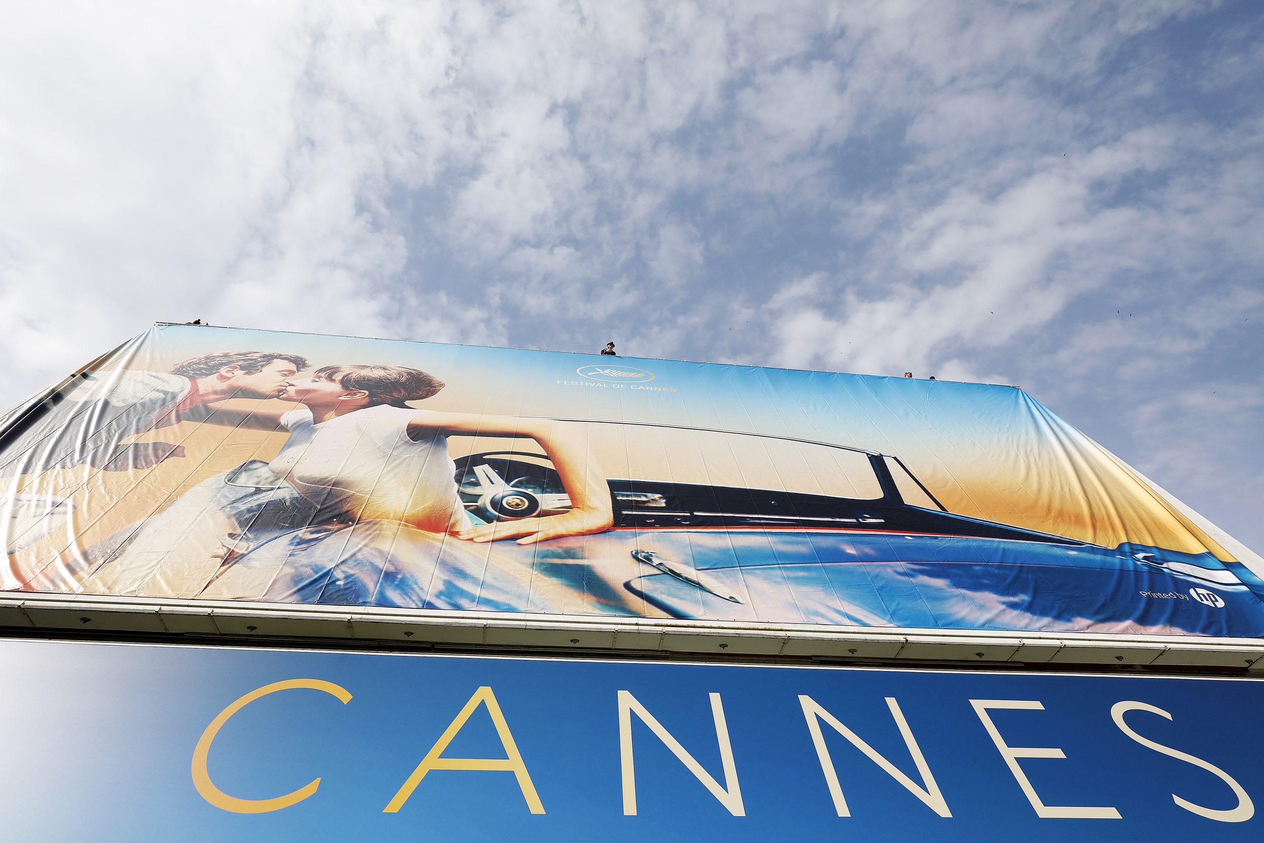 epa08969060 (FILE) - Workers set up the official poster of the 71st annual Cannes Film Festival on the Palais des Festivals facade, in Cannes, France, 06 May 2018 (reissued 27 January 2021). According to media reports, the Cannes Film Festival 2021 was cancelled, organizers announced. The Festival de Cannes, initially scheduled from 11 to 22 May 2021, will now take place from 06 to 17 July 2021.  EPA/SEBASTIEN NOGIER *** Local Caption *** 55967241