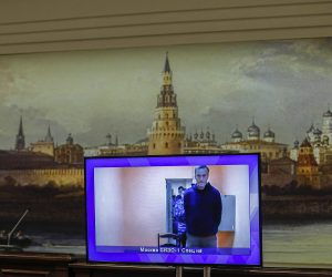 epa08970766 Opposition leader Alexei Navalny is shown on a monitor screen during a hearing of an appeal against the detention in Moscow's Region Court in Krasnogorsk outside Moscow, Russia, 28 January 2021.  Alexei Navalny was detained after his arrival to Moscow from Germany on 17 January 2021. A Moscow judge on 18 January ruled that he will remain in custody for 30 days following his airport arrest.  EPA/YURI KOCHETKOV