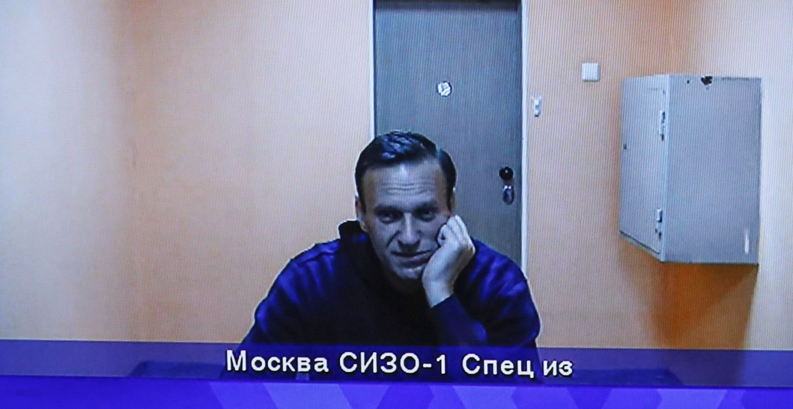 epa08970902 Opposition leader Alexei Navalny is shown on a monitor screen during a hearing of an appeal against the detention in Moscow Region Court in Krasnogorsk outside Moscow, Russia, 28 January 2021. Alexei Navalny was detained after his arrival to Moscow from Germany on 17 January 2021. A Moscow judge on 18 January ruled that he will remain in custody for 30 days following his airport arrest.  EPA/YURI KOCHETKOV