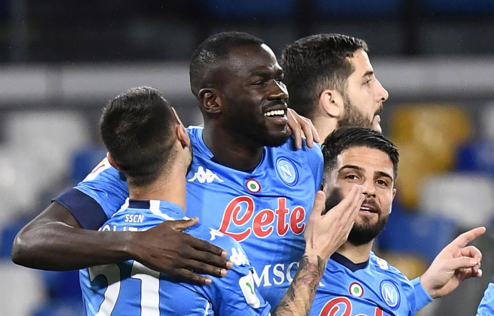 epa08971861 Napoli's defender Kalidou Koulibaly (2L) celebrates with his teammates after scoring the 1-0 lead during the Italian Cup quarter final soccer  match between SSC Napoli and  Spezia  at the Diego Armando Maradona stadium in Naples, Italy, 28 January 2021.  EPA/CIRO FUSCO