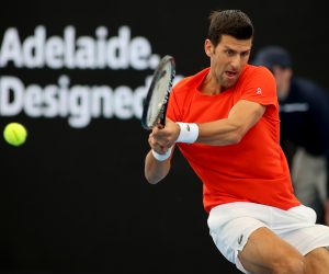 epa08972277 Novak Djokovic of Serbia plays a backhand against Jannik Sinner of Italy during their match at the 'A Day at the Drive' tennis event at Memorial Drive Tennis Centre in Adelaide, Australia, 29 January 2021.  EPA/KELLY BARNES AUSTRALIA AND NEW ZEALAND OUT
