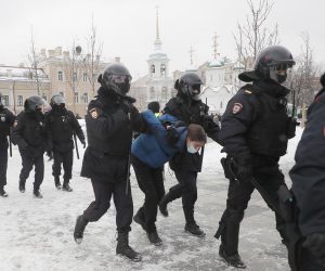 epa08976741 Russian police officers detains protester during an unauthorized protest in support of Russian opposition leader Alexei Navalny, Moscow, Russia, 31 January 2021. Navalny was detained after his arrival to Moscow from Germany on 17 January 2021. A Moscow judge on 18 January ruled that he will remain in custody for 30 days following his airport arrest. Navalny urged Russians to take to the streets to protest. In many Russian cities mass events are prohibited due to an increase in COVID-19 cases.  EPA/SERGEI ILNITSKY