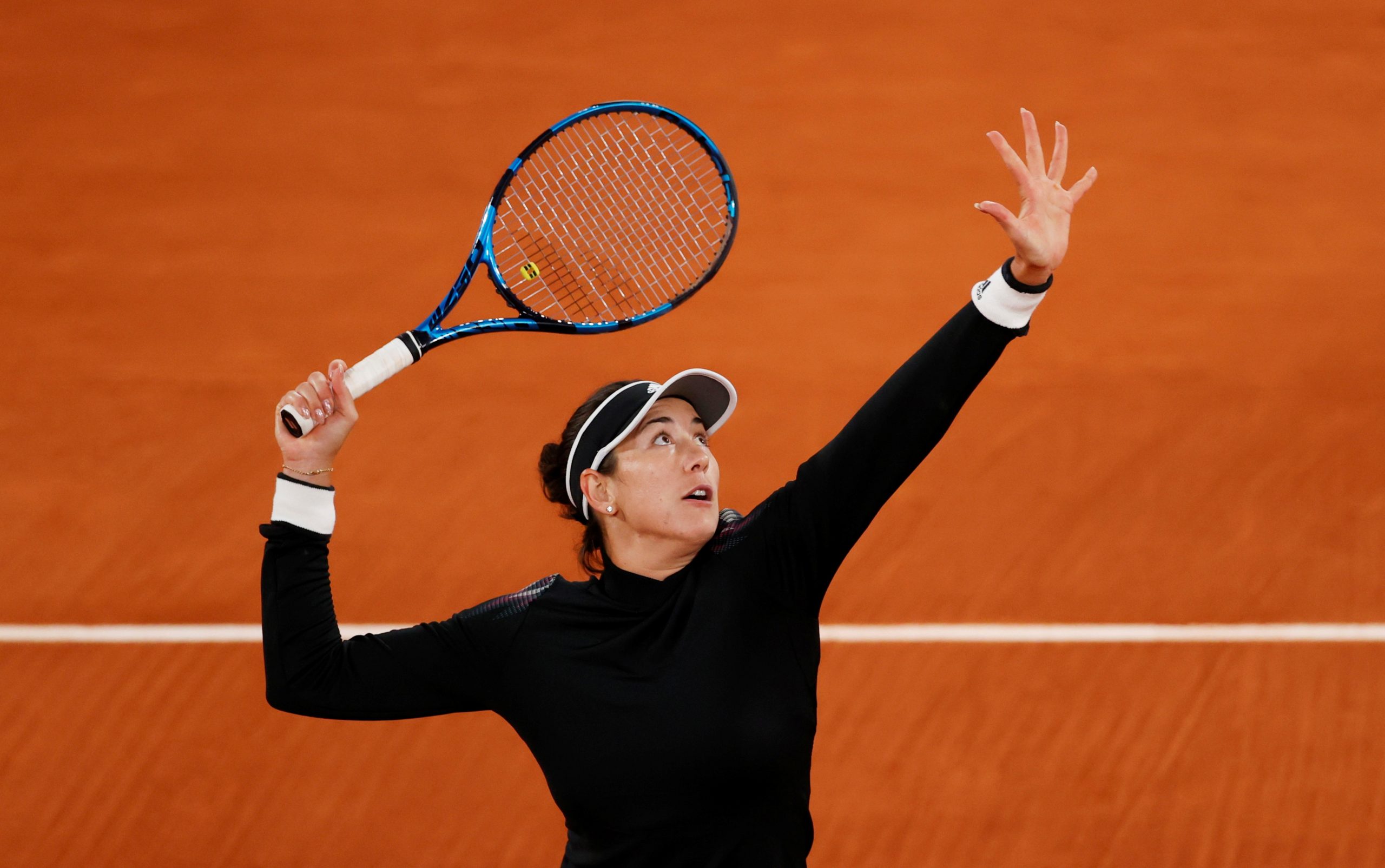 FILE PHOTO: French Open FILE PHOTO: Tennis - French Open - Roland Garros, Paris, France - October 3, 2020  Spain's Garbine Muguruza in action during her third round match against Danielle Rose Collins of the U.S REUTERS/Christian Hartmann/File Photo CHRISTIAN HARTMANN