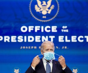 U.S. President-elect Joe Biden announces Justice Department nominees at his transition headquarters in Wilmington, Delaware U.S. President-elect Joe Biden removes his face mask as he arrives to announce his Justice Department nominees at his transition headquarters in Wilmington, Delaware, U.S., January 7, 2021. REUTERS/Kevin Lamarque     TPX IMAGES OF THE DAY KEVIN LAMARQUE