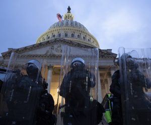 epa08923720 Police stand outside the East Front of the US Capitol at dusk as a curfew begins after pro-Trump protesters stormed the grounds leading to chaos, in Washington, DC, USA, 06 January 2021. Various groups of Trump supporters have broken into the US Capitol and rioted as Congress prepares to meet and certify the results of the 2020 US Presidential election.  EPA/MICHAEL REYNOLDS