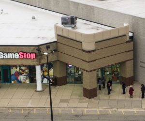 epa08969952 (FILE) - An aerial photo made with a drone shows customers lined up outside a GameStop electronics store on Black Friday in Gurnee, Illinois, USA, 27 November 2020 (reissued 27 January 2021.) The electronic game retailer has seen it's stock price soar from 3.25 US dollars in April 2020 to close at 347.51 US dollars on 27 January. The company has drawn interest from investors in online chat groups and created as much as 3 billion US dollars in value losses for short sellers.  EPA/TANNEN MAURY