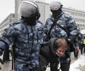 epa08976825 Russian police officers detain protester during an unauthorized protest in support of Russian opposition leader Alexei Navalny, Moscow, Russia, 31 January 2021. Navalny was detained after his arrival to Moscow from Germany, where he was recovering from a poisoning attack with a nerve agent, on 17 January 2021. A Moscow judge on 18 January ruled that he will remain in custody for 30 days following his airport arrest. Navalny urged Russians to take to the streets to protest. In many Russian cities mass events are prohibited due to an increase in COVID-19 cases.  EPA/YURI KOCHETKOV