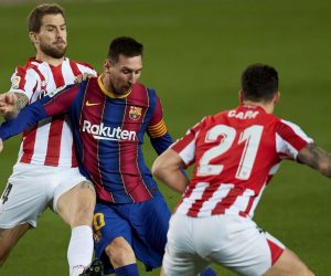 epa08978728 FC Barcelona's striker Lionel Messi (C) vies for the ball with Athletic's defenders Inigo Martinez (L) and Ander Capa (R) during the Spanish LaLiga soccer match between FC Barcelona and Athletic Club Bilbao held at Camp Nou stadium, in Barcelona, Spain, 31 January 2021.  EPA/Alejandro Garcia