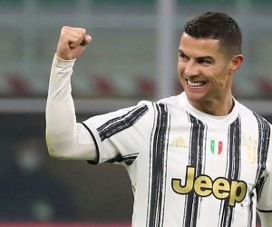 epa08982555 Juventus’ Cristiano Ronaldo celebrates after scoring the 1-2 goal during the Italy Cup semifinal first leg soccer match between FC Inter and Juventus FC at Giuseppe Meazza stadium in Milan, Italy, 02 February 2021.  EPA/MATTEO BAZZI