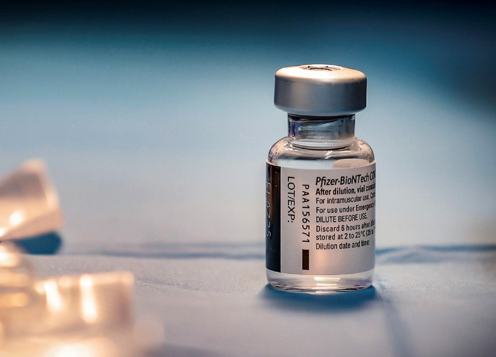 epa08996502 A view of a vial containing the Pfizer-BioNTech vaccine against the coronavirus disease (COVID-19) during vaccinations for people over 80 years old at the Santa Maria della Pieta' hospital, in Rome, Italy, 08 February 2021.  EPA/GIUSEPPE LAMI