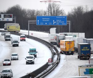 epa08996990 Truck got stuck at an uphill slope on the snow-covered A2 motorway near Dortmund, Germany, 08 February 2021. A heavy winter storm with cold easterly winds brings ice and fresh fallen snow with snow drifts. Many railway services in the West are disrupted.  EPA/FRIEDEMANN VOGEL