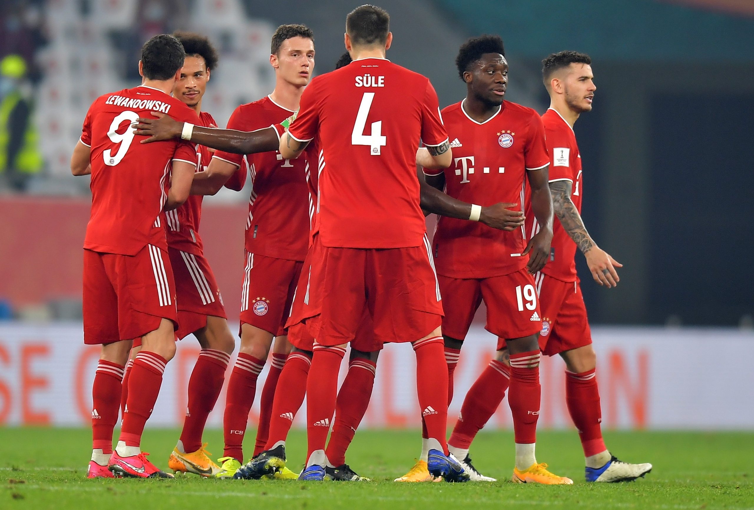 epa09005160 Benjamin Pavard (3-L) of Bayern Munich celebrates with teammates after scoring the opening goal during the final soccer match between Bayern Munich and Tigres UANL at the FIFA Club World Cup in Al Rayyan, Qatar, 11 February 2021.  EPA/NOUSHAD THEKKAYIL