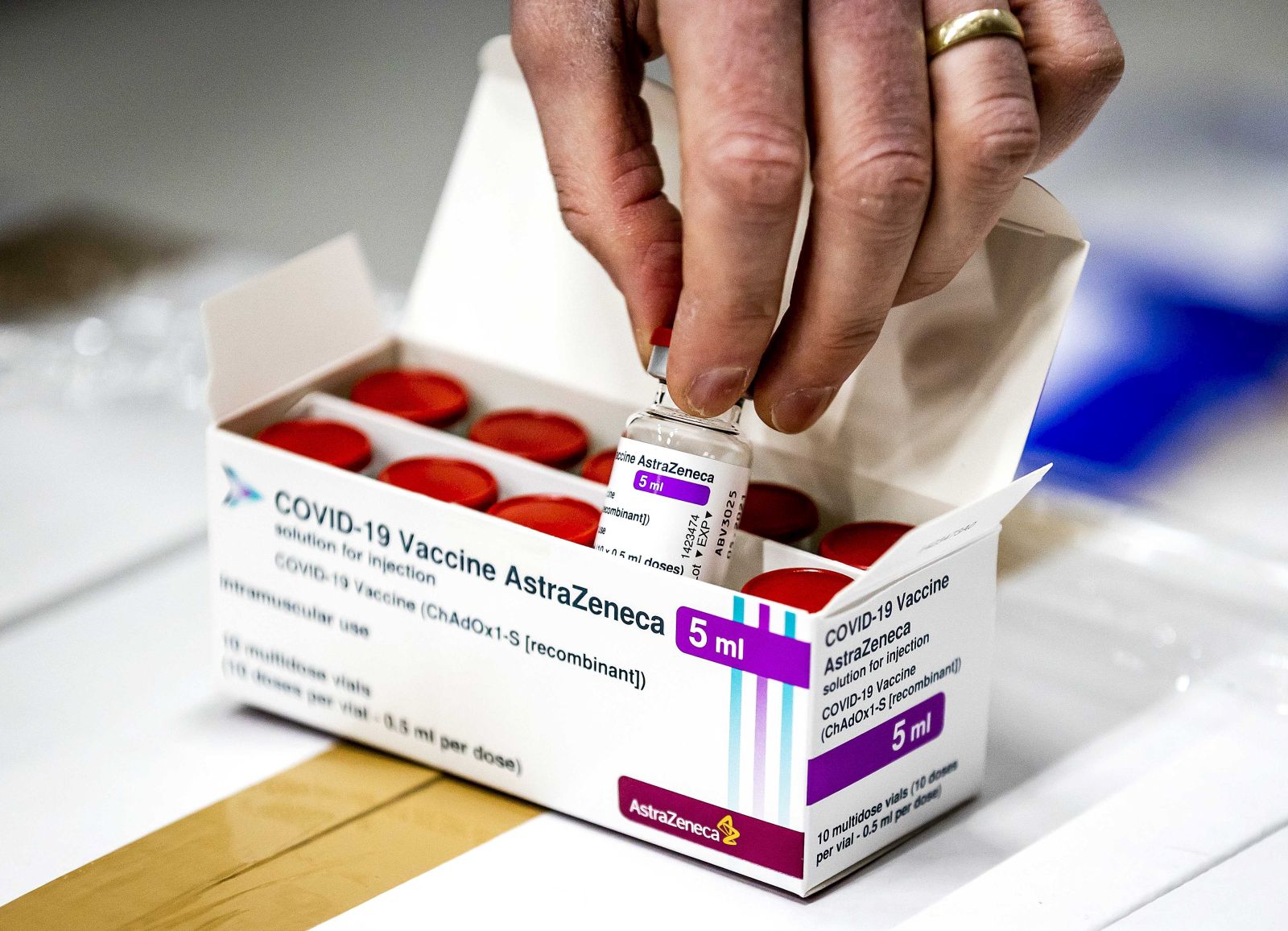 epa09006260 A vial of AstraZeneca's covid-19 vaccine stored in Movianto in Oss, The Netherlands, 12 February 2021. People diagnosed with obesity, Down's syndrome or a neurological condition that makes breathing difficult will have the priority to take the vaccine.  EPA/Remko de Waal
