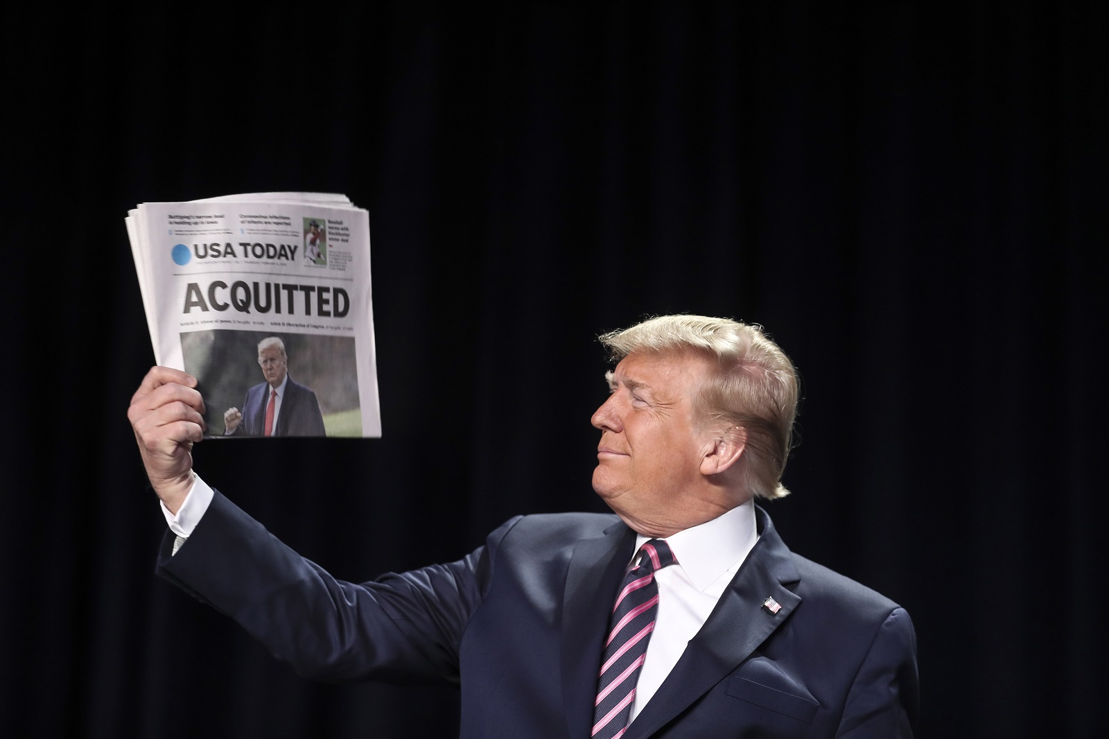 epa09010714 (FILE) - US President Donald J. Trump holds a copy of the USA Today newspaper fronting with his impeachment acquittal, as he arrives to the 68th Annual National Prayer Breakfast in Washington, DC, USA, 06 February 2020 (reissued 13 February 2021). The US Senate on 13 February 2021 voted to acquit former US president Trump in his second impeachment trial held on the charge of incitement of insurrection for his role in 06 January violent attack on the US Capitol.  EPA/Oliver Contreras / POOL *** Local Caption *** 55853899