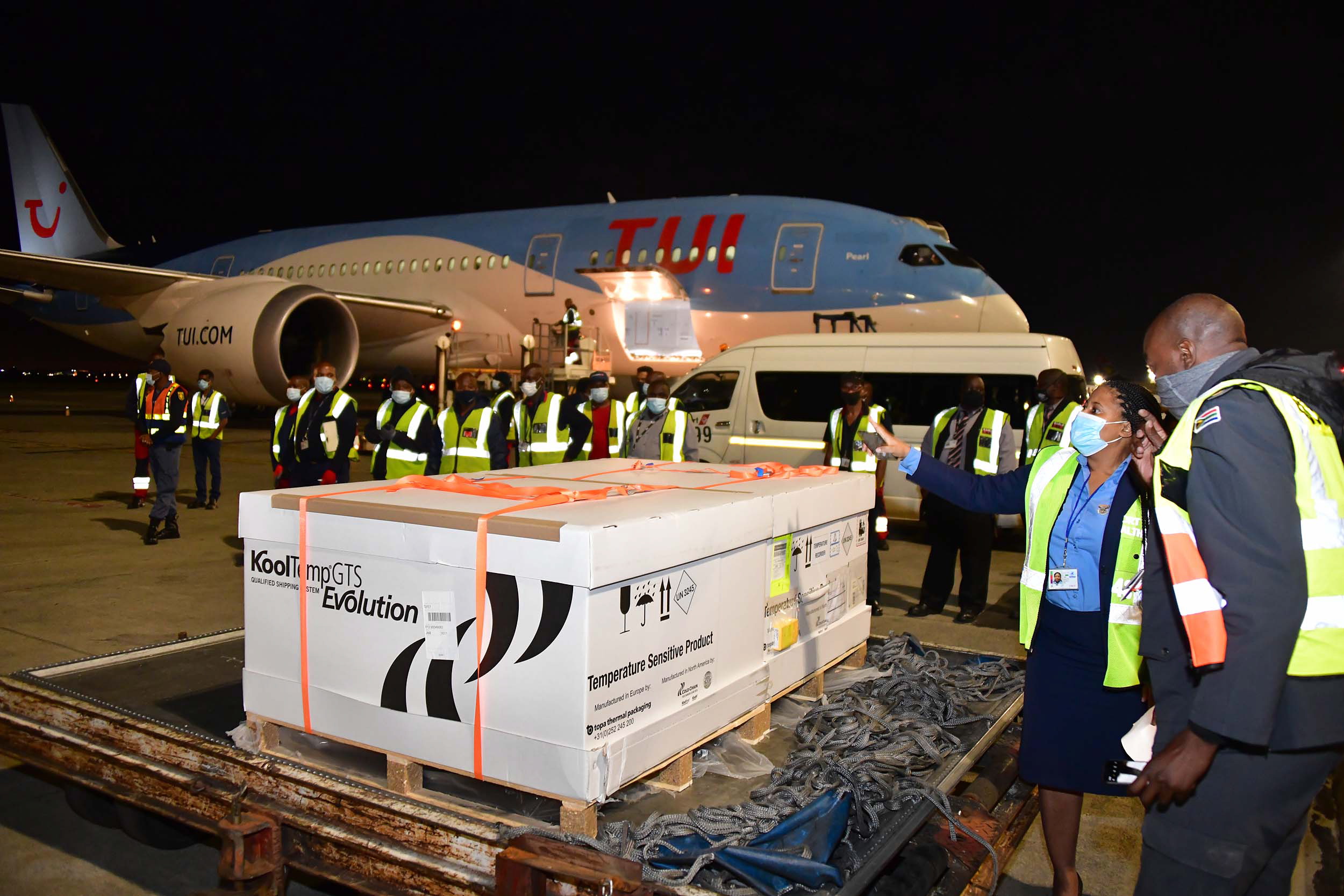 epa09017355 A handout photo made available by South Africa's Government Information Services (GCIS) shows the first delivery of the Johnson & Johnson COVID-19 vaccine arriving at the O R Tambo International Airport in Johannesburg, South Africa, 17 February 2021. The vaccine has been approved by South African Health Products Authority and is expected to only be given to health care workers. The consignment will be moved to a secure facility before being distributed overnight to the various vaccine centers in all provinces.  EPA/BABA JIYANE/GCIS HANDOUT  HANDOUT EDITORIAL USE ONLY/NO SALES