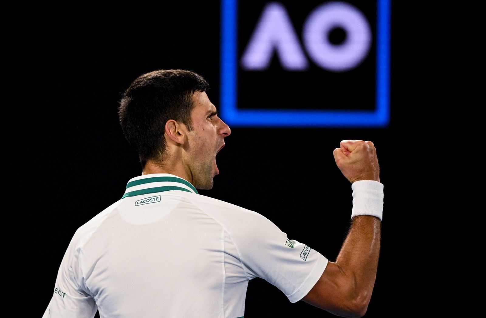 epa09027371 Novak Djokovic of Serbia reacts during his Men's singles finals match against Daniil Medvedev of Russia on Day 14 of the Australian Open Grand Slam tennis tournament at Melbourne Park in Melbourne, Australia, 21 February 2021.  EPA/DEAN LEWINS AUSTRALIA AND NEW ZEALAND OUT