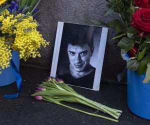 epa09039869 Flowers and tributes at the site where Russian opposition politician Boris Nemtsov died during an event marking the sixth anniversary of his assassination, in Moscow, Russia, 27 February 2021. Boris Nemtsov was killed on 27 February 2015 by suspected Chechen hitmen on a bridge in front of the Kremlin.  EPA/SERGEI ILNITSKY