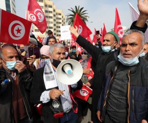 epa09040625 Followers of Tunisia's largest political Islamist party Ennahda stage a rally in opposition to President Kais Saied in Tunis, Tunisia, 27 February 2021.  EPA/MOHAMED MESSARA