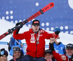 FIS Alpine World Ski Championships Alpine Skiing - FIS Alpine World Ski Championships - Cortina d'Ampezzo, Italy - February 16, 2021 Croatia's Filip Zubcic celebrates with the silver medal and his team after finishing second in the men's parallel REUTERS/Denis Balibouse DENIS BALIBOUSE