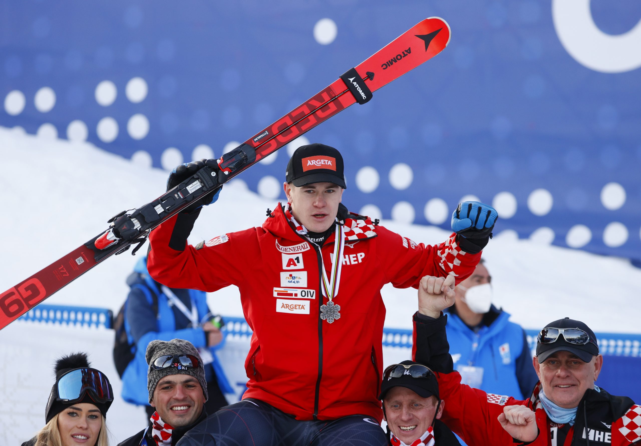 FIS Alpine World Ski Championships Alpine Skiing - FIS Alpine World Ski Championships - Cortina d'Ampezzo, Italy - February 16, 2021 Croatia's Filip Zubcic celebrates with the silver medal and his team after finishing second in the men's parallel REUTERS/Denis Balibouse DENIS BALIBOUSE