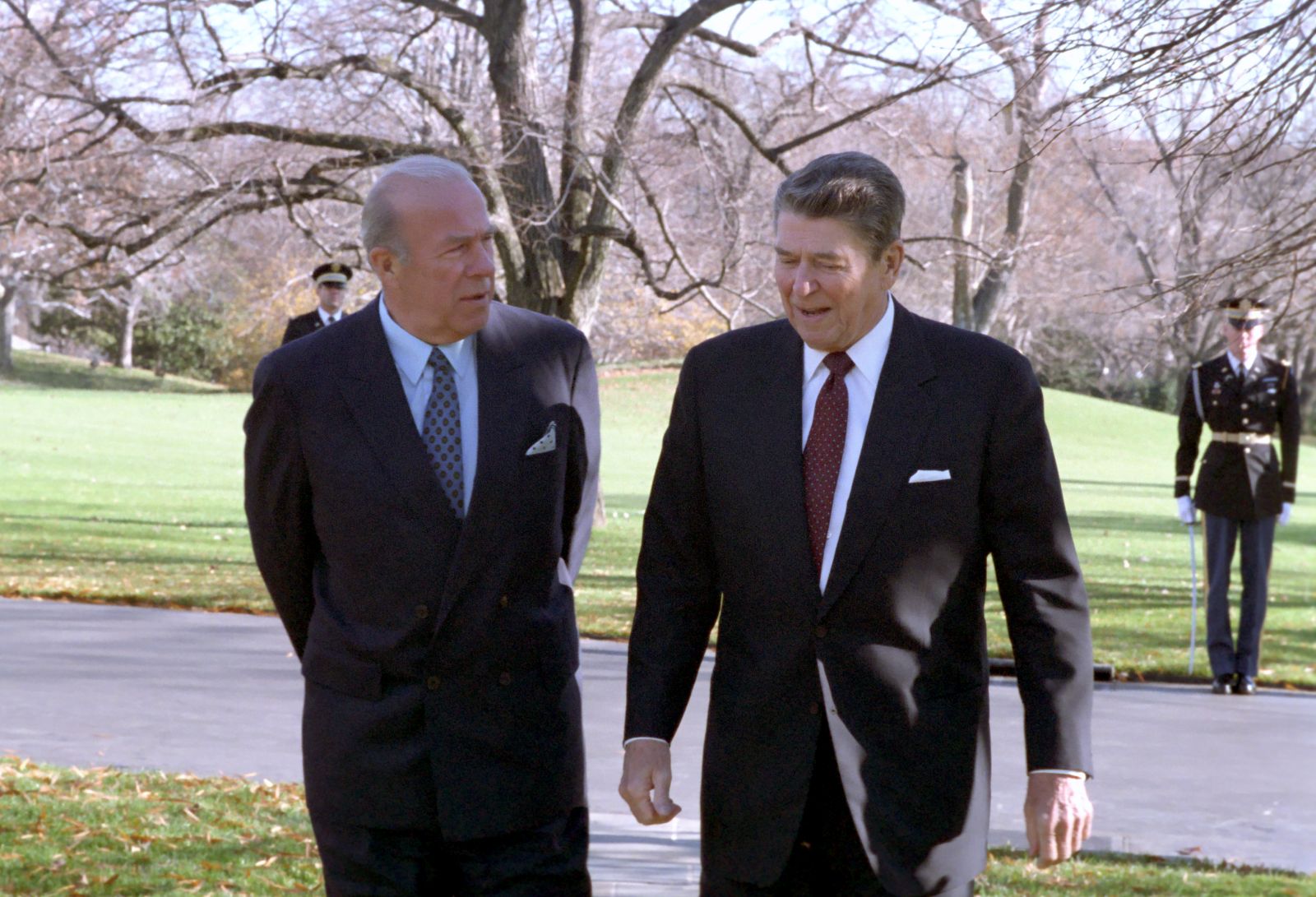 12/4/1986 President Reagan walking with George Shultz outside the Oval Office