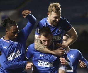 epa09036557 Borna Barisic (C) of Rangers celebrates with teammates after scoring the 4-2 lead from the penalty spot during the UEFA Europa League round of 32, second leg soccer match between Glasgow Rangers and Royal Antwerp FC in London, Britain, 25 February 2021.  EPA/Ian McNicol / POOL