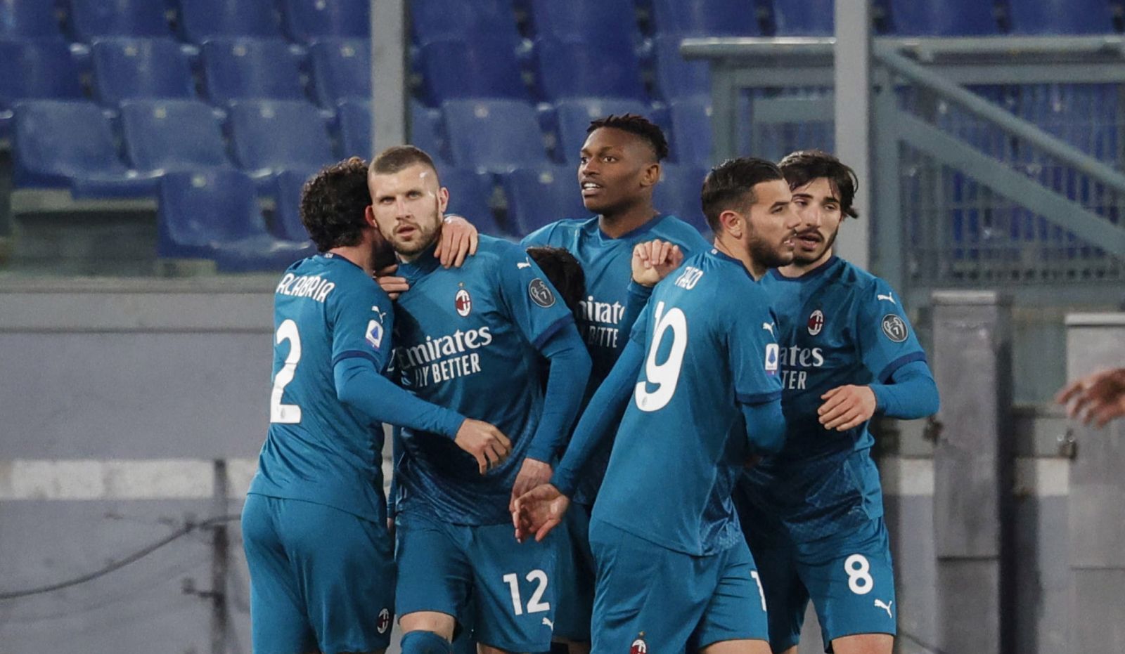 epa09043595 Milan's Ante Rebic (2-L) celebrates with his teammates after scoring the 2-1 lead during the Italian Serie A soccer match between AS Roma and AC Milan at the Olimpico stadium in Rome, Italy, 28 February 2021.  EPA/GIUSEPPE LAMI