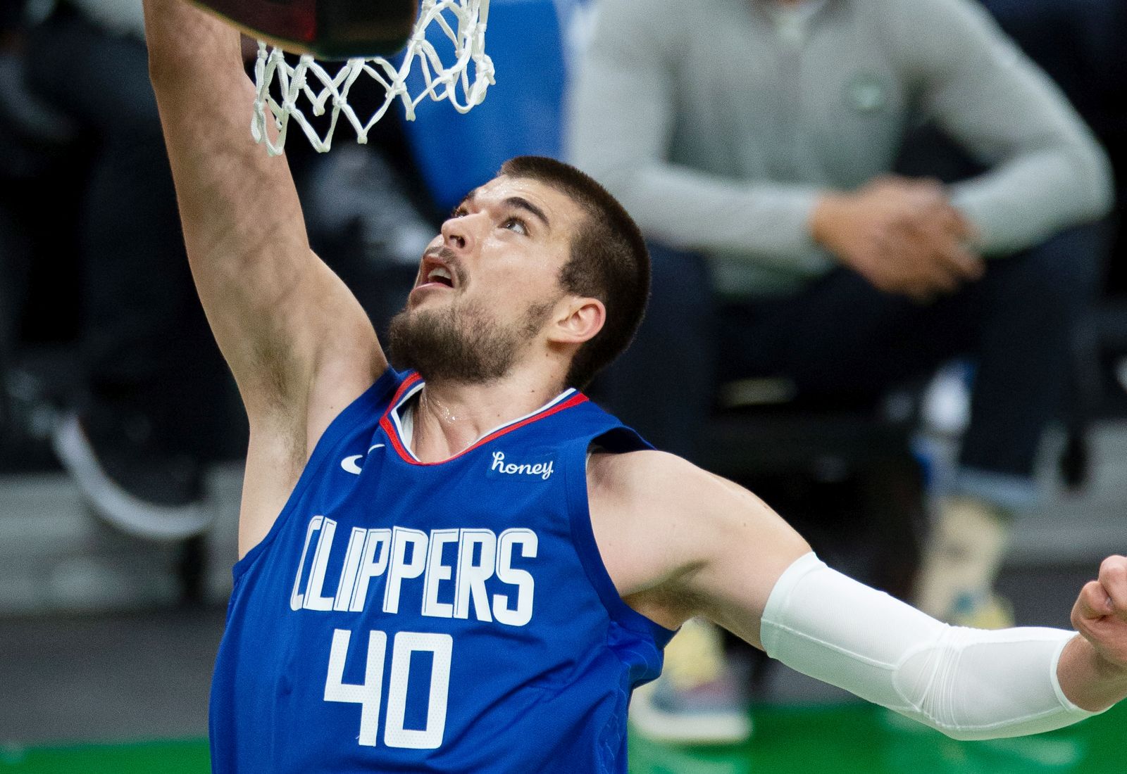 epa09047690 Los Angeles Clippers center Ivica Zubac tips the ball in during the fourth quarter of the NBA basketball game between the Los Angeles Clippers aand Boston Celtics at the TD Garden in Boston, Massachusetts, USA, 02 March 2021.  EPA/CJ GUNTHER SHUTTERSTOCK OUT