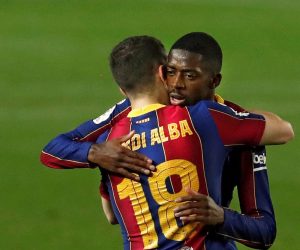 epa09049810 FC Barcelona's striker Ousmane Dembele (R) celebrates with teammate Jordi Alba (L) after scoring the 1-0 lead during the second leg soccer match of the Spanish King's Cup semi final between FC Barcelona and Sevilla CF held at Camp Nou stadium, in Barcelona, Spain, 03 March 2021.  EPA/Alberto Estevez