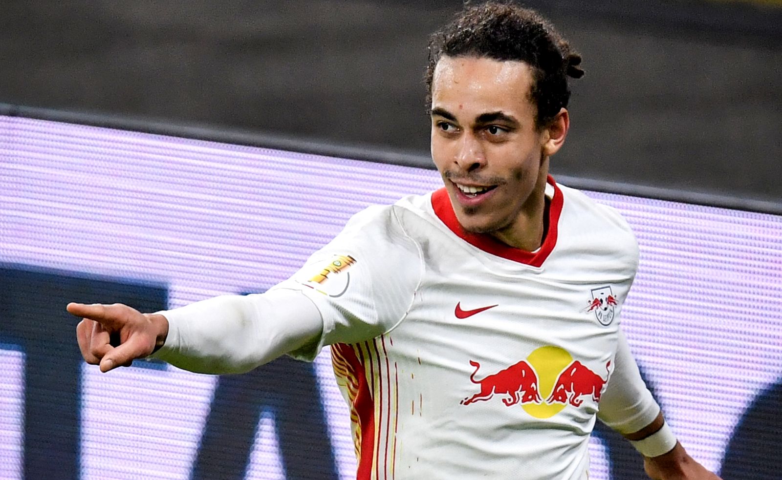 epa09049978 Leipzig's Yussuf Poulsen celebrates after scoring the 1-0 lead during the German DFB Cup quarter final soccer match between RB Leipzig and VfL Wolfsburg in Leipzig, Germany, 03 March 2021.  EPA/STUART FRANKLIN / POOL DFB regulations prohibit any use of photographs as image sequences and/or quasi-video.