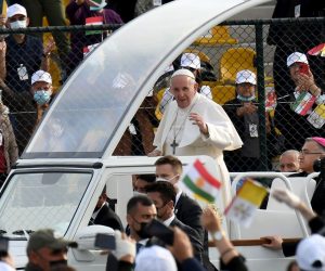 epa09059280 Pope Francis () greets faithful as he arrives to celebrate the Holy Mass at the 'Franso Hariri' Stadium in Erbil, Iraq, 07 March 2021. Pope Francis began on 05 March a three-day official visit in Iraq, the first papal visit to this country affected throughout the years by war, insecurity and lately COVID-19 Coronavirus pandemic.  EPA/ALESSANDRO DI MEO