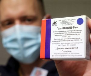 epa09063696 A pharmacist holds a packet of Sputnik V vaccines to be used for the second dose in the pharmacy of the Borsod-Abauj-Zemplen County Medical Center and University Teaching Hospital in Miskolc, Hungary, 09 March 2021.  EPA/JANOS VAJDA HUNGARY OUT