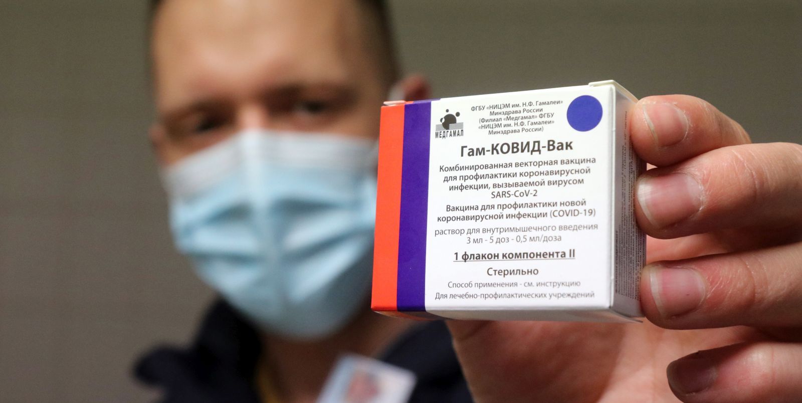 epa09063696 A pharmacist holds a packet of Sputnik V vaccines to be used for the second dose in the pharmacy of the Borsod-Abauj-Zemplen County Medical Center and University Teaching Hospital in Miskolc, Hungary, 09 March 2021.  EPA/JANOS VAJDA HUNGARY OUT