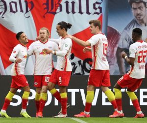 epa09074026 Emil Forsberg of RB Leipzig celebrates with Yussuf Poulsen, Alexander Sorloth and Nordi Mukiele after scoring their side's first goal  during the Bundesliga match between RB Leipzig and Eintracht Frankfurt at Red Bull Arena in Leipzig, Germany, 14 March 2021.  EPA/BORIS STREUBEL / POOL DFL regulations prohibit any use of photographs as image sequences and/or quasi-video.