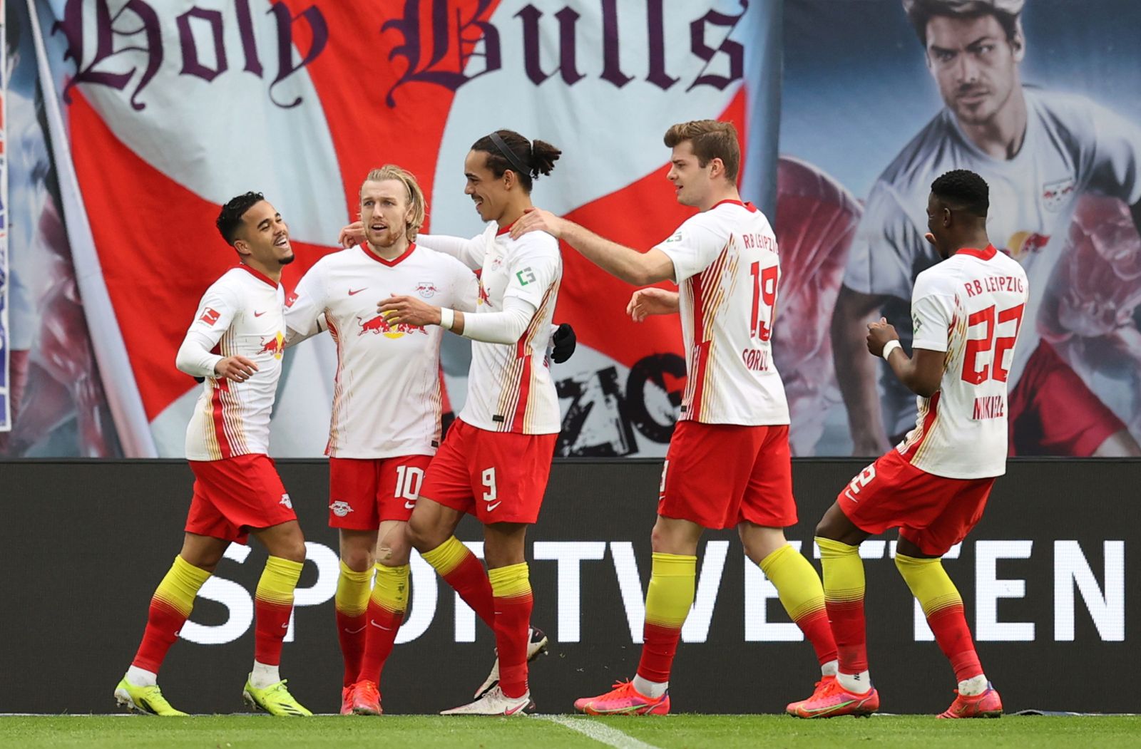 epa09074026 Emil Forsberg of RB Leipzig celebrates with Yussuf Poulsen, Alexander Sorloth and Nordi Mukiele after scoring their side's first goal  during the Bundesliga match between RB Leipzig and Eintracht Frankfurt at Red Bull Arena in Leipzig, Germany, 14 March 2021.  EPA/BORIS STREUBEL / POOL DFL regulations prohibit any use of photographs as image sequences and/or quasi-video.