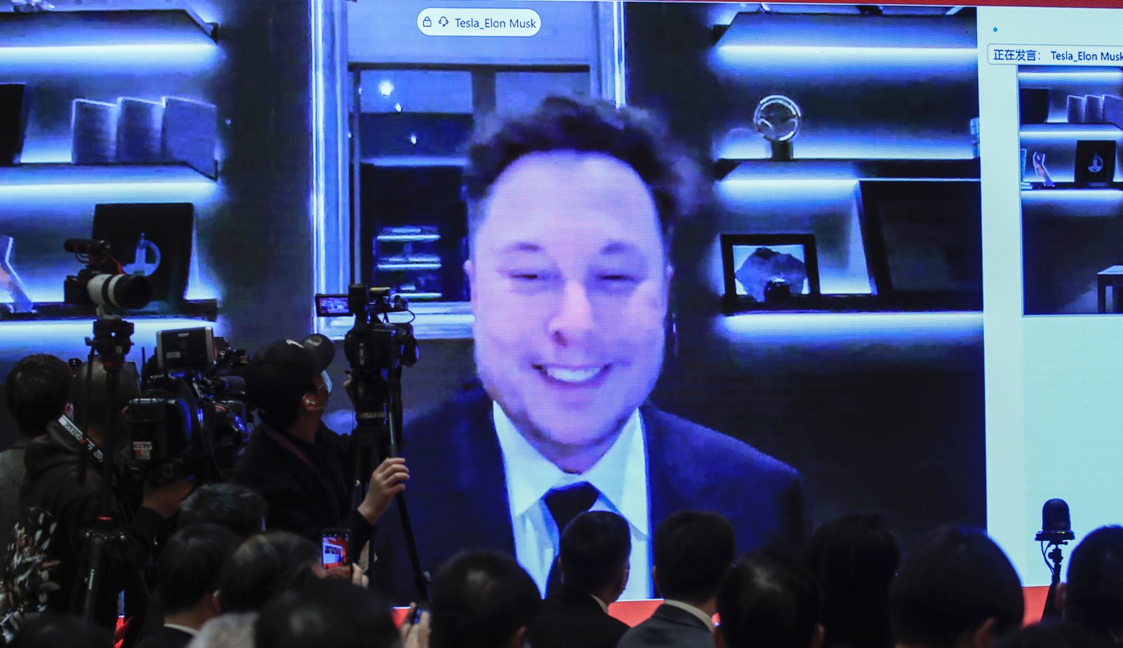 epa09084843 A video shows Elon Musk, CEO of Tesla Inc., speaking during the China Development Forum 2021 at the Diaoyutai State Guesthouse in Beijing, China, 20 March 2021. The China Development Forum 2021 is held in Beijing from 20 to 22 March 2021, with the theme of 'China On a New Journey of Modernisation.'  EPA/WU HONG