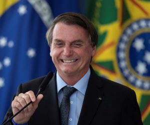 epa09090278 Brazilian President Jair Bolsonaro participates in an investment announcement for the Aguas Brasileiras Program on increasing the quantity and quality of water available for consumption, at the Palacio do Planalto, in the city of Brasilia, Brazil, 22 March 2021.  EPA/Joedson Alves
