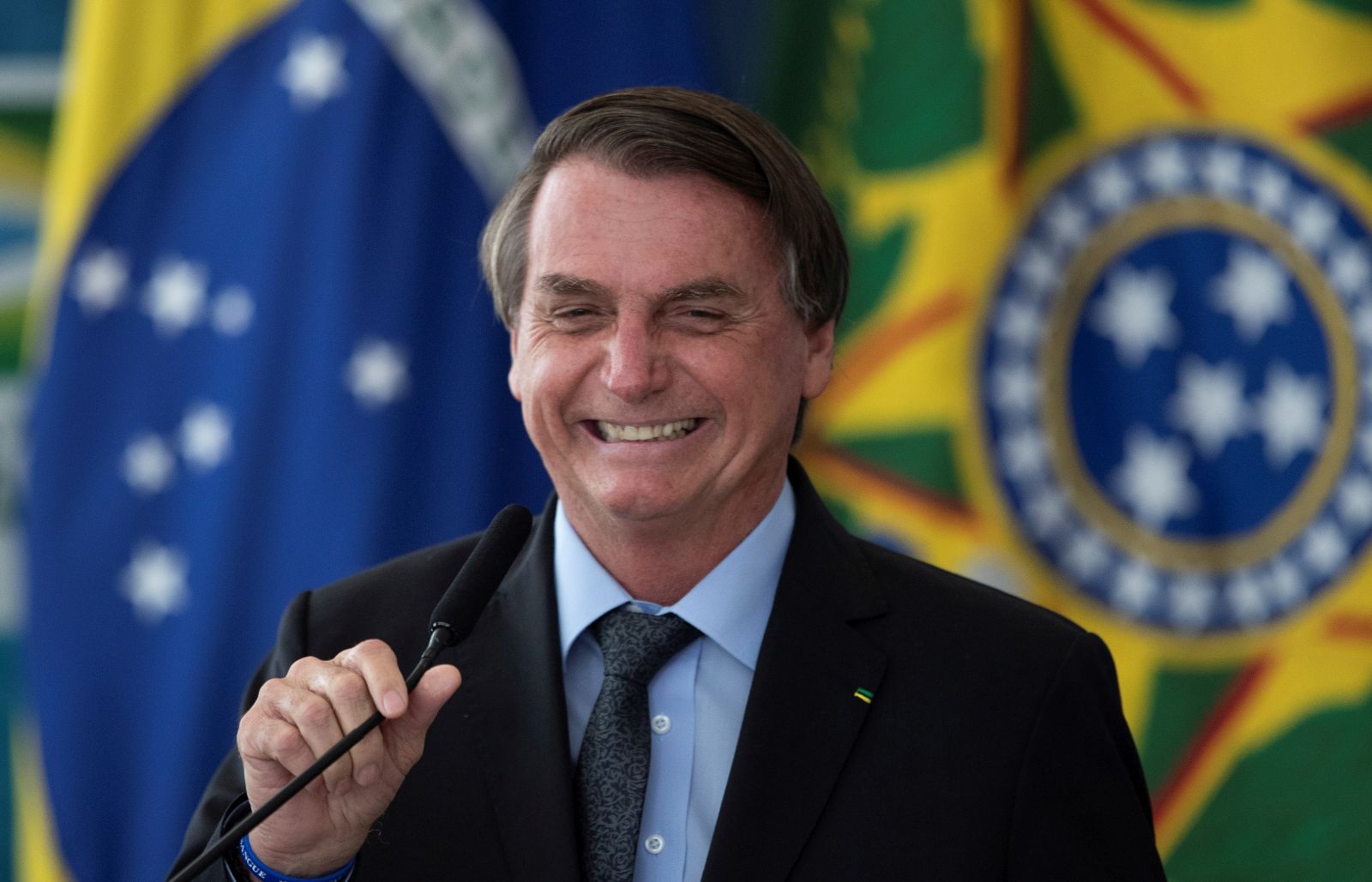 epa09090278 Brazilian President Jair Bolsonaro participates in an investment announcement for the Aguas Brasileiras Program on increasing the quantity and quality of water available for consumption, at the Palacio do Planalto, in the city of Brasilia, Brazil, 22 March 2021.  EPA/Joedson Alves