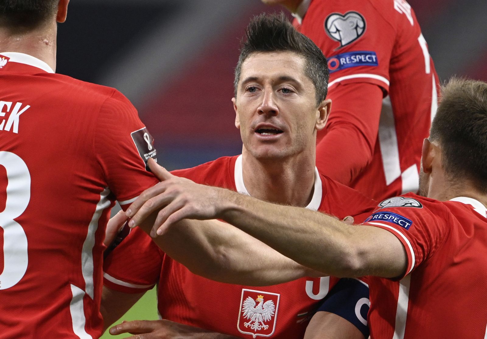 epa09097900 Robert Lewandowski (C) of Poland celebrates with team-mates after scoring the 3-3 goal during the FIFA World Cup 2022 qualifying soccer match between Hungary and Poland in the Puskas Ferenc Arena in Budapest, Hungary, 25 March 2021.  EPA/Zsolt Szigetvary HUNGARY OUT
